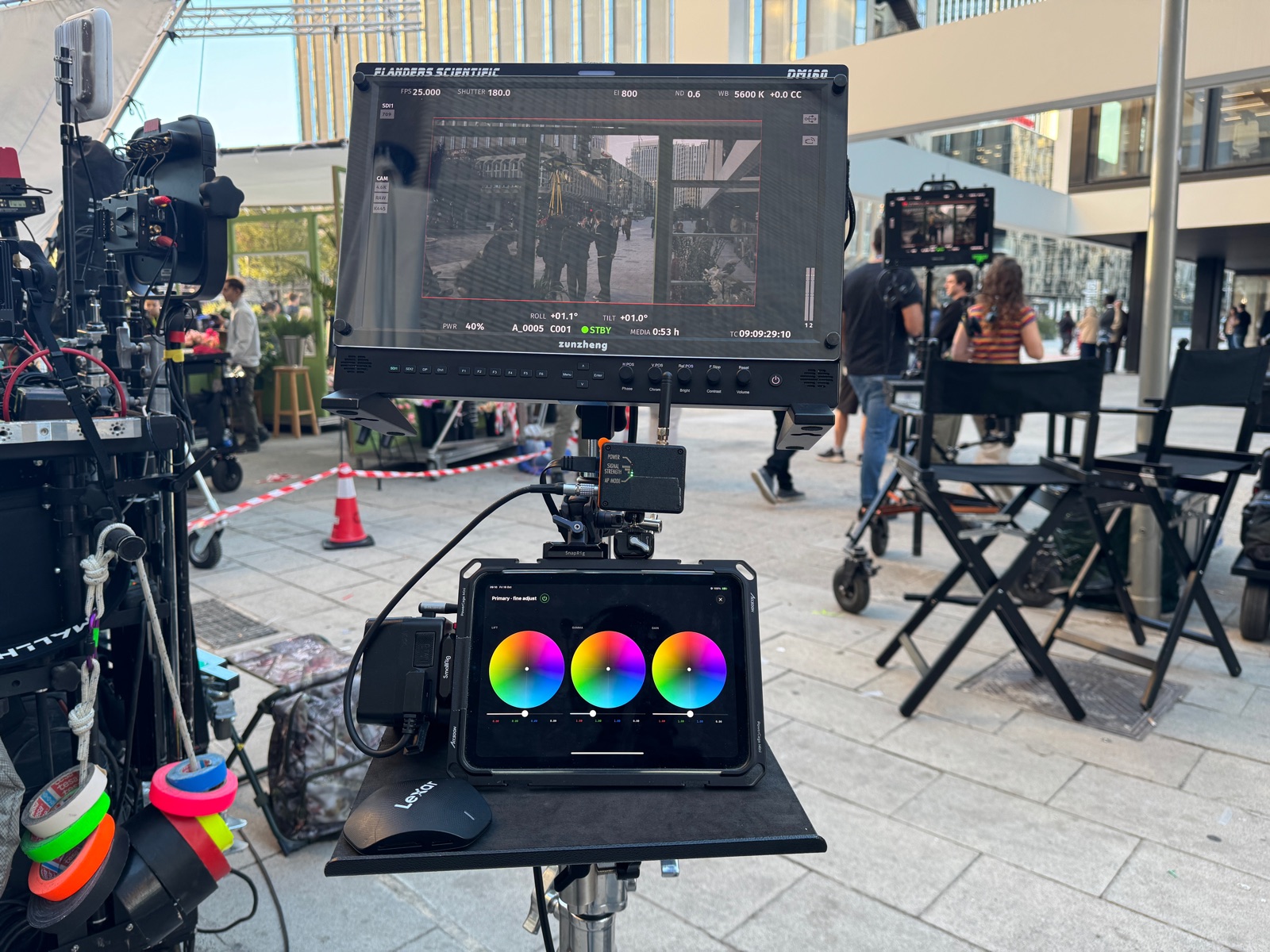 Morning on set: the DM160 and the iPad with GRADE between the camera cart and the director chairs, crew setting up behind